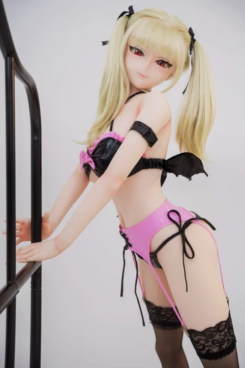 Abby HSS 148cm Irokebijin sex doll with blonde pigtails in pink and black lingerie leaning on railing against simple backdrop