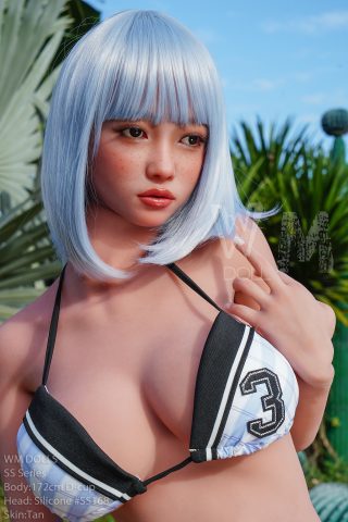 172cm D Cup WM Doll in a black and white bikini, featuring short silver hair and a tan skin tone, surrounded by greenery.