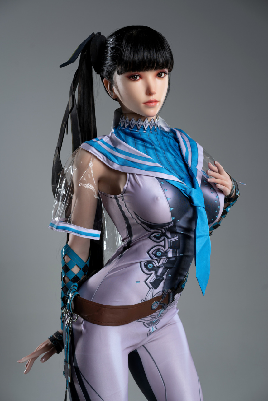 GameLady Eva Lady.27 sex doll in futuristic outfit with blue tie against neutral backdrop.