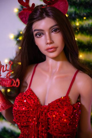 YL 158cm Isla Christmas doll wearing a red sequined dress and reindeer antlers, holding a festive sign in front of a decorated tree.