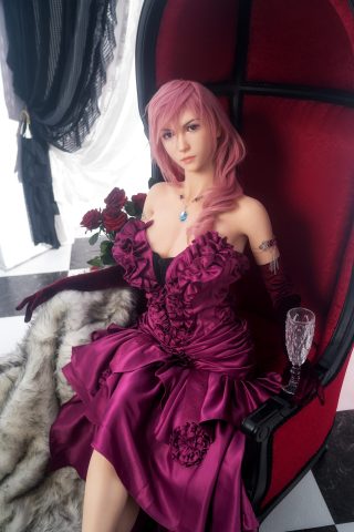 A fair-skinned lady with long pink hair sits elegantly in a red and black chair, wearing a deep purple dress adorned with ruffles and roses. She holds a glass and has a fur throw draped beside her.