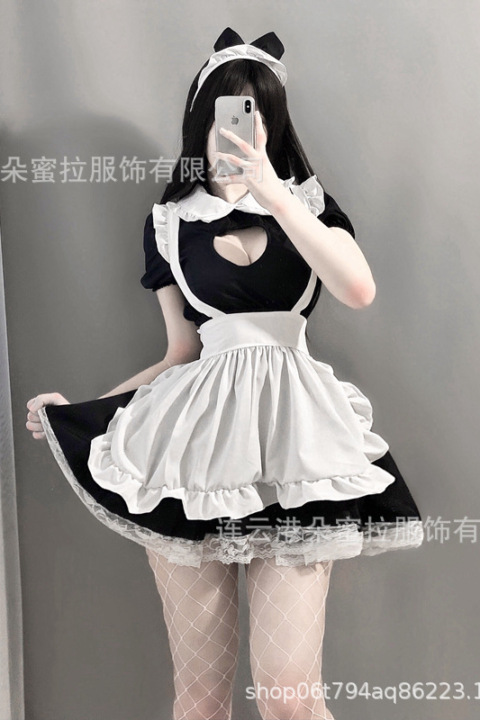 Sex doll dressed in black and white maid lingerie set with headband, white apron, and fishnet stockings.