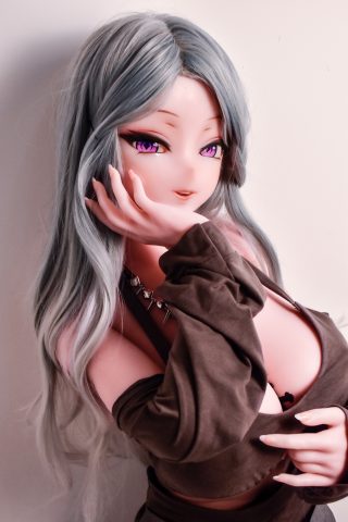 A silicone doll with long, wavy gray hair and striking purple eyes, wearing a dark, off-shoulder top, poses playfully with one hand near her face.