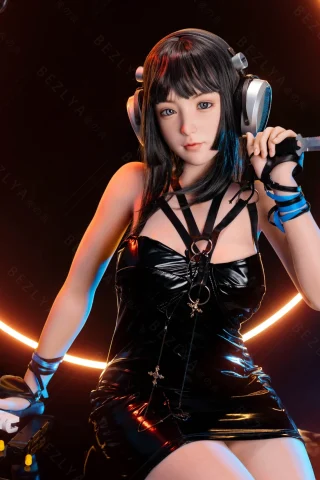 A doll with dark hair and headphones sits on a futuristic platform, wearing a black latex dress, holding a knife, with a glowing circular backdrop.