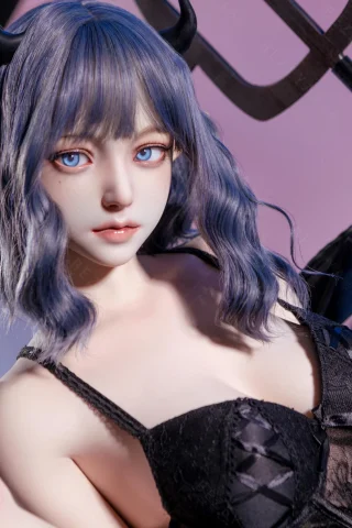 Pose features a playful, seductive expression. Dark, lacy outfit contrasts with blue hair and striking blue eyes. Background has soft purple tones.
