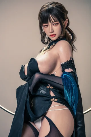 Subject features a striking pose with a confident expression. Dressed in a black outfit with intricate details, showcasing a blend of elegance and allure. The setting is minimalistic, enhancing the focus on the subject.