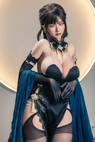 Subject features a figure in a revealing black outfit with lace accents, complemented by a blue velvet shawl. The background includes a circular light, enhancing the dramatic effect.