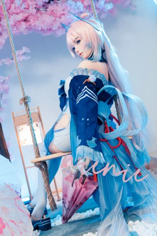 Cyrtenthera1 features a figure on a swing, wearing a blue and white outfit with flowing sleeves, pastel hair, and an umbrella, set against cherry blossoms.
