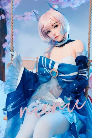 Subject in a blue and white outfit with a large bow, sitting on a swing surrounded by cherry blossoms. Soft pastel colors enhance the ethereal vibe.