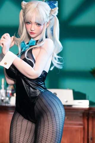 Pose features a playful stance, with one hand on the hip. Clothing is a black bodysuit with a blue bow tie. The setting has a bar-like background with a teal wall.