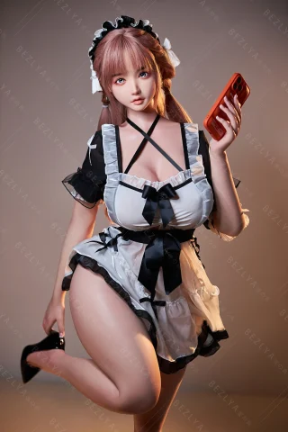 Maid-themed doll in a black and white outfit, holding a phone. Features pink hair, high heels, and a playful pose.