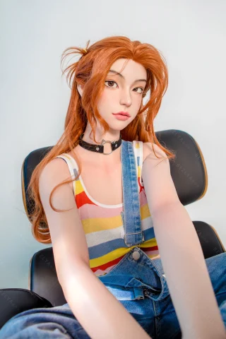 Subject features long, wavy orange hair styled with playful clips. Dressed in a striped tank top and denim overalls, seated casually.