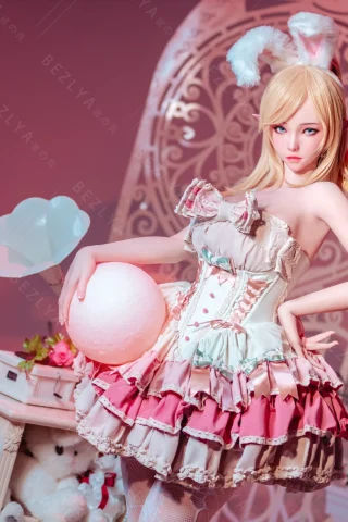 Doll in a playful bunny outfit, featuring pastel colors, frilly layers, and a whimsical setting with soft lighting.