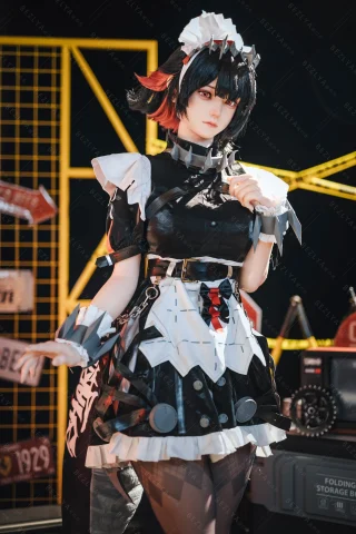 Subject: Campanula in a black and white dress with ruffled layers, bold red accents, and a striking hairstyle, set against an industrial backdrop.