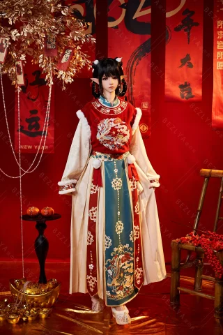 Subject in a vibrant traditional outfit featuring intricate embroidery, layered fabrics, and bold colors. Set against a red backdrop with festive decorations.