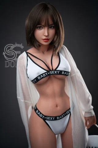 A doll with short brown hair wearing a white sheer cover-up and black lingerie with the text "BABY SEXY" in bold.