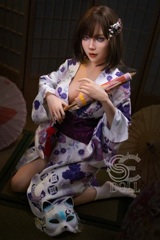 A doll in a floral kimono kneels with a traditional Japanese umbrella, holding a decorative flute, and a fox mask nearby.