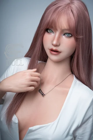 Realistic SES054-T160-C doll with pink hair and a necklace, showcasing detailed facial features and a stylish outfit.