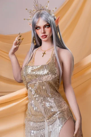 Elven doll with silver hair, golden dress, and ornate accessories, showcasing a fantasy-inspired design.