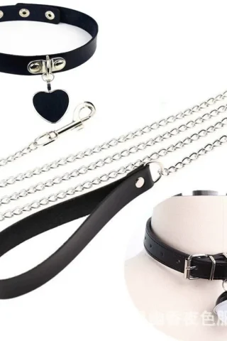 Leather bell collar dog traction toy with a heart charm and chain leash for stylish pet control.