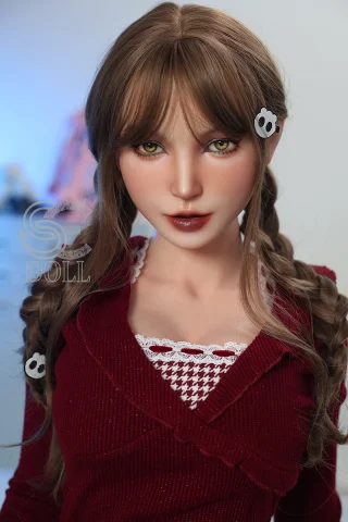 Realistic SES053 doll features braided hair and striking green eyes, dressed in a stylish red outfit.