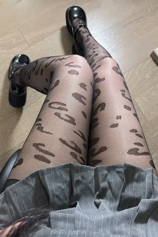 Leopard Print Retro Jacquard Stockings feature a black and brown leopard pattern, worn with a gray skirt and black shoes.