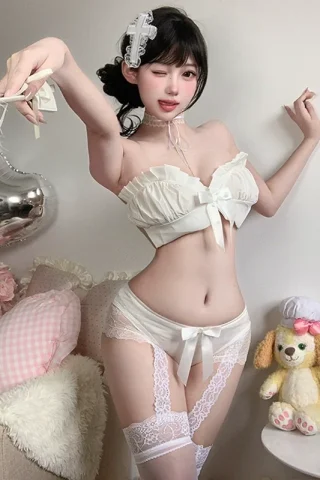 Sexy lace maid lingerie uniform featuring a strapless top with a bow, matching panties, and thigh-high stockings in a cozy setting.