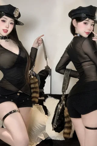 Sexy mesh long sleeve pajamas dress featuring a sheer black top, shorts, and accessories, posed with a playful expression.