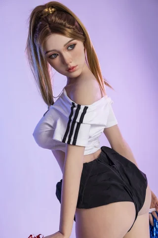 Xue 171cm C-Cup Starpery doll wearing an off-shoulder white top and black shorts, posed with a slight turn and playful expression.