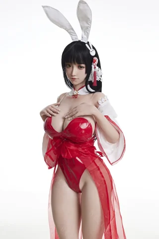 Bezlya 157cm doll in a red outfit with sheer layers, bunny ears, and a decorative hairpiece.