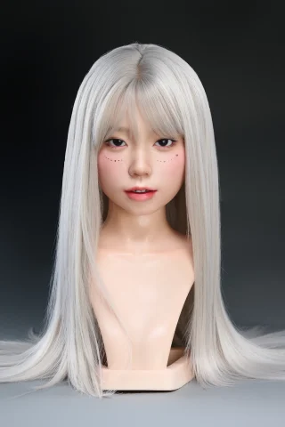 #70 WM silicone doll head with long silver hair, featuring subtle freckles and a neutral expression against a dark background.